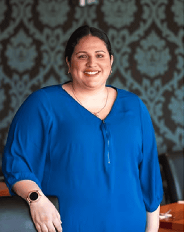 Diana standing inside The Fat Duck Te Anau restaurant, smiling in the dining area.